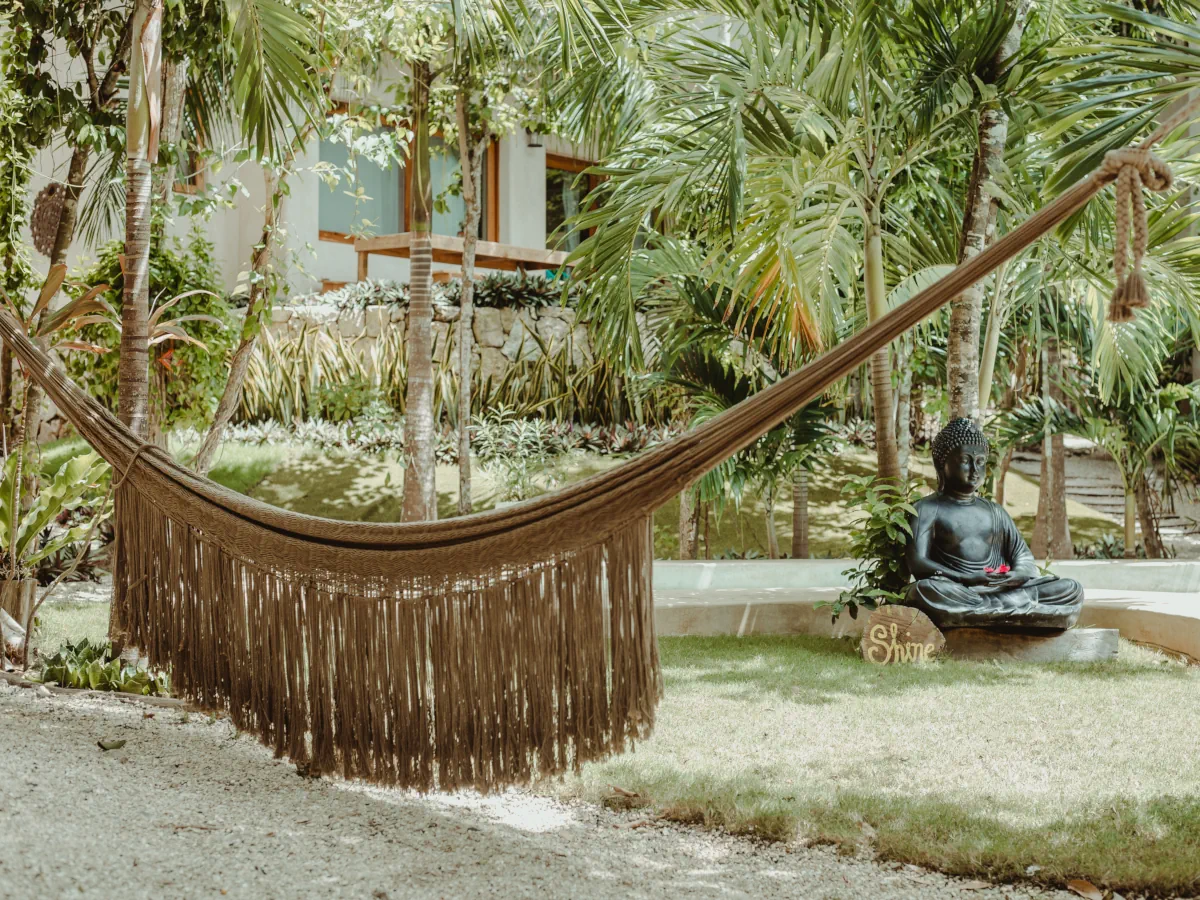Hammocks and terraces surrounded by greenery in a boutique hotel in Tulum